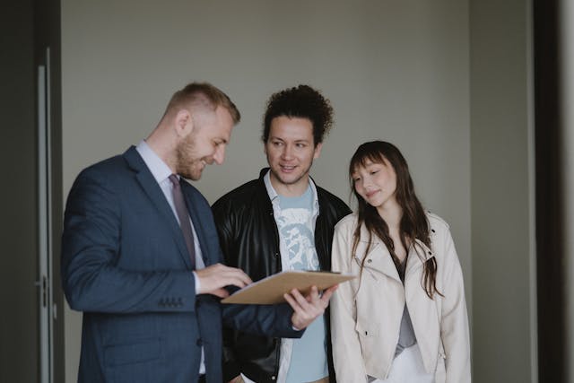 a property manager going over a lease with prospects